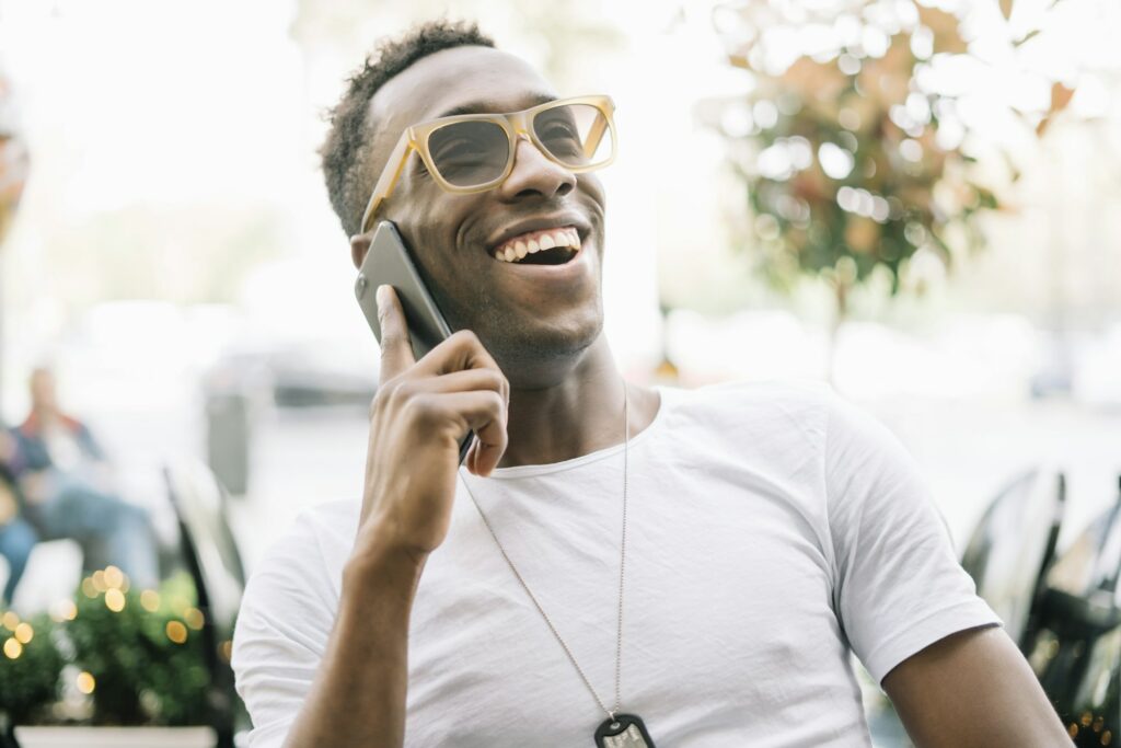 African man using mobile phone.
